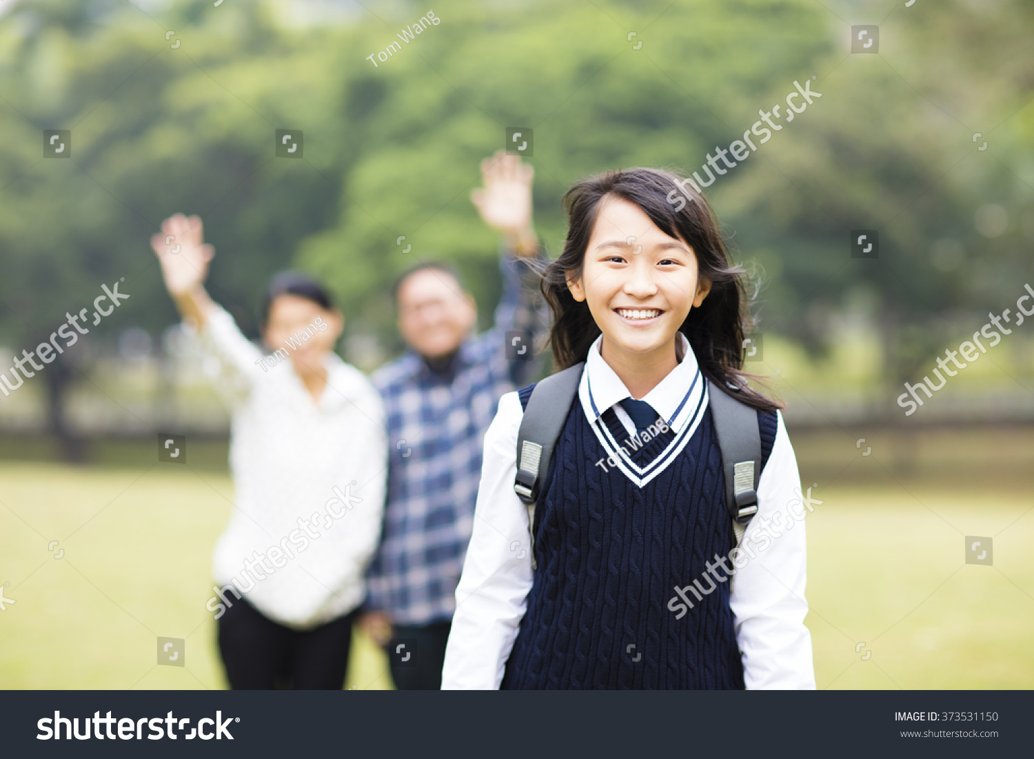 cute young student girl with parent in school