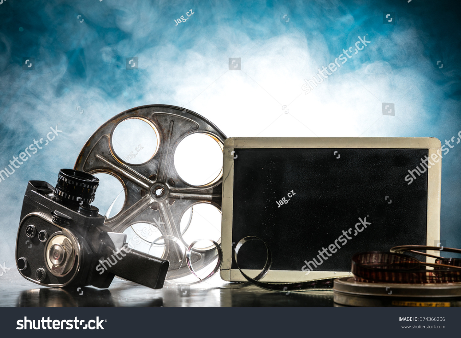 Retro film production accessories still life. Concept of film-making. Smoke effect on background