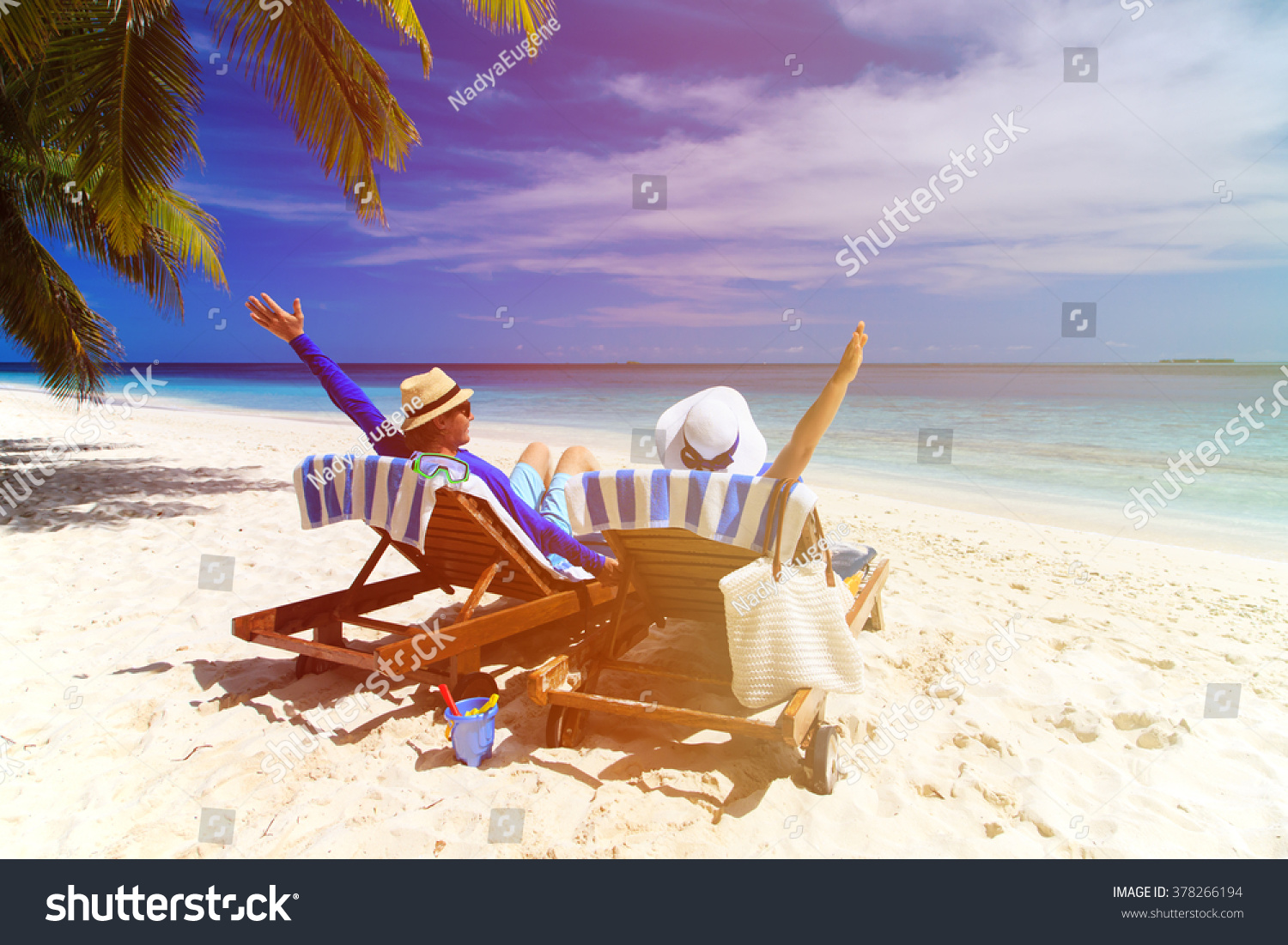 happy couple relax on a tropical beach