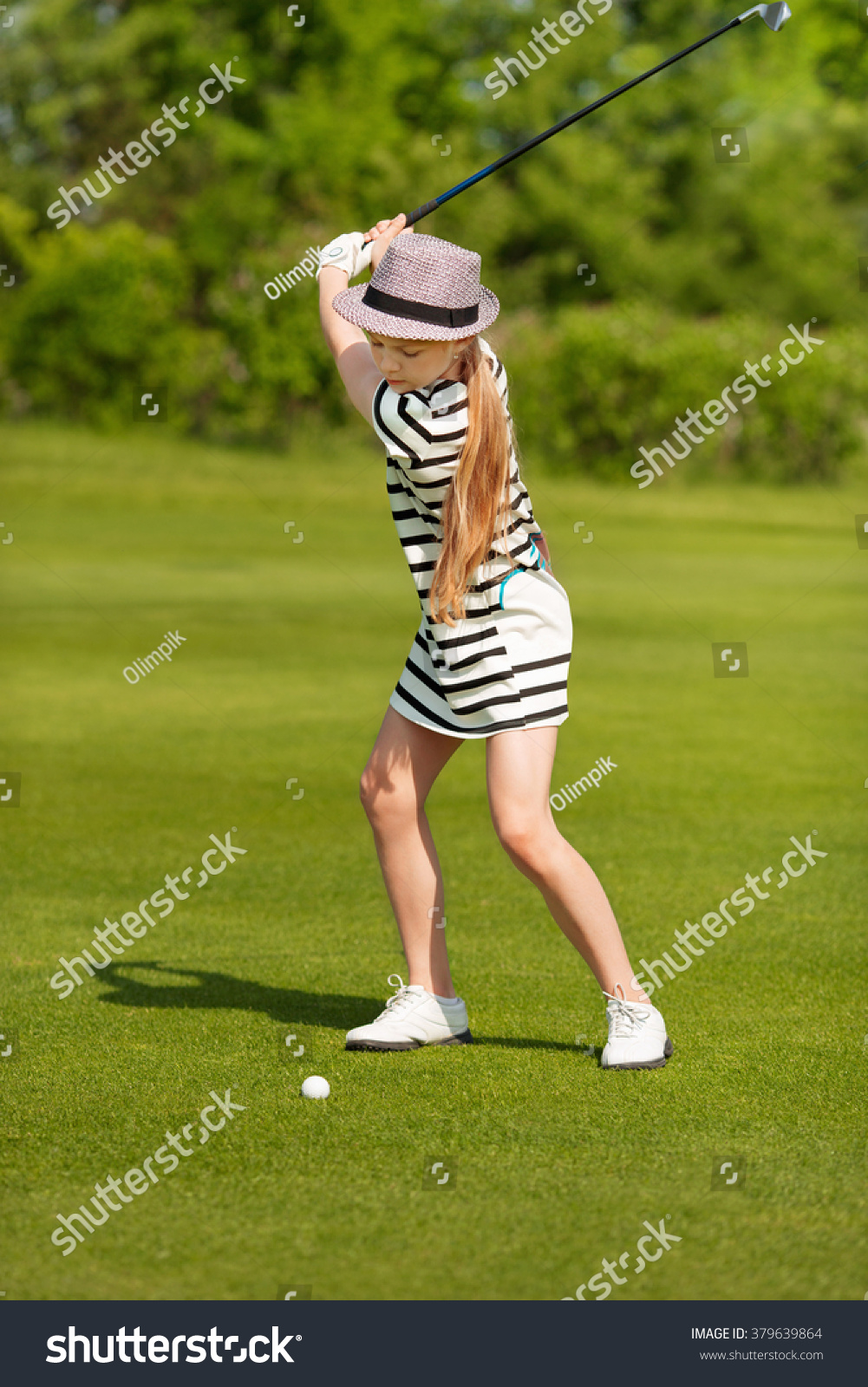 Girl playing golf