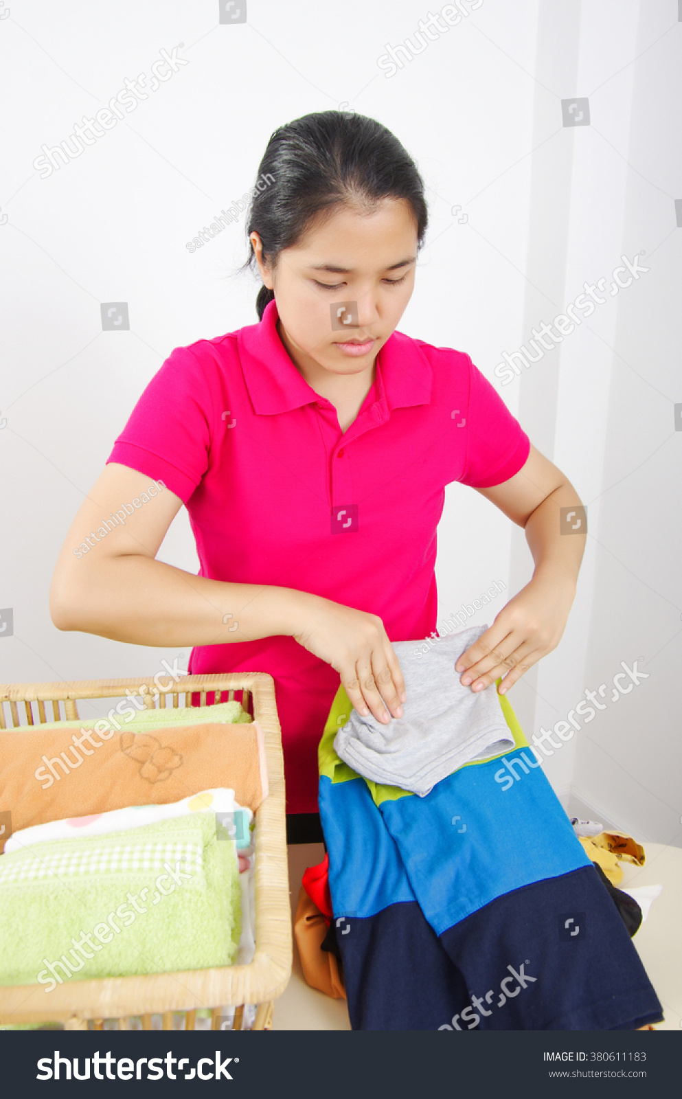 Asia woman fold cloth