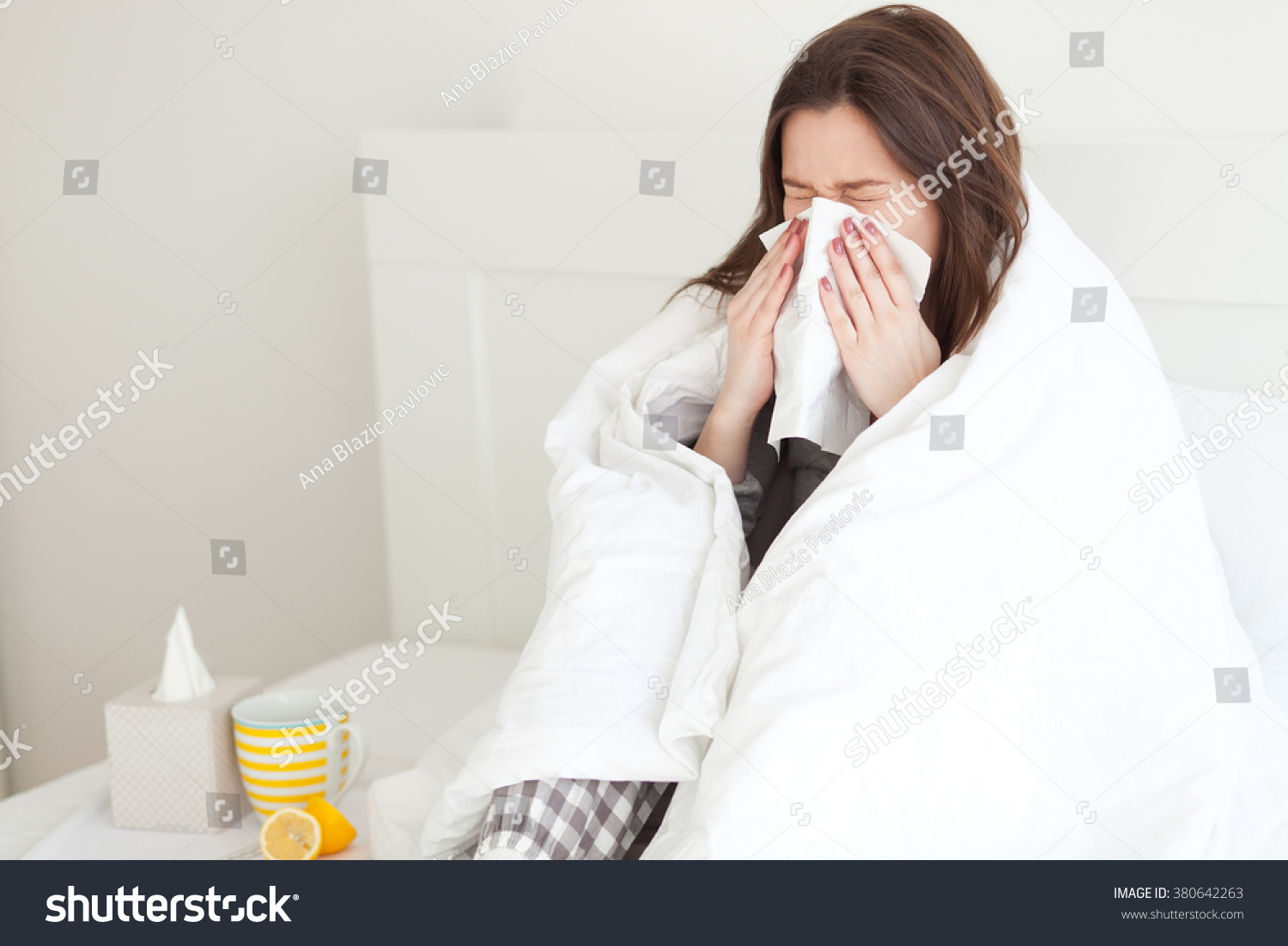 Young woman sick in bed