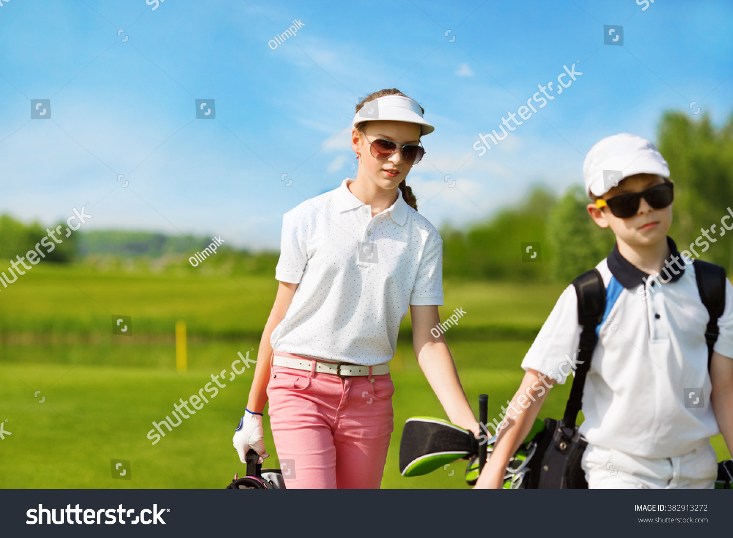 Kids warming up at golf school at summer day