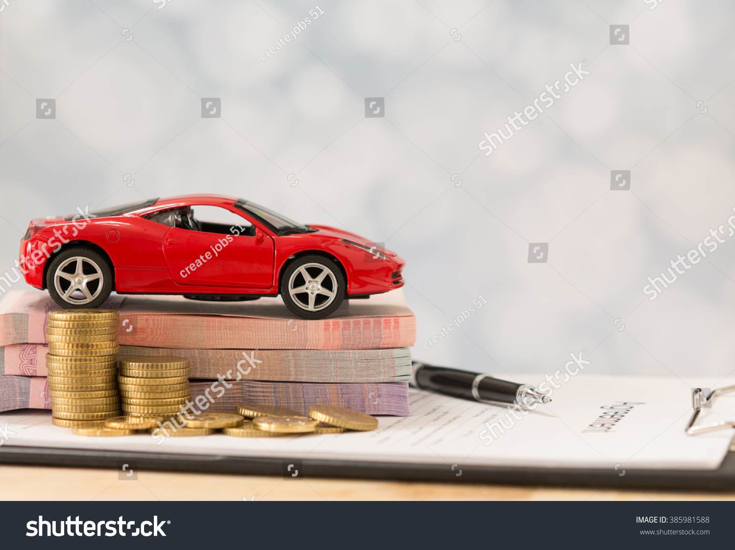 Car loan money  banknote on agreement document or car insurance application form.