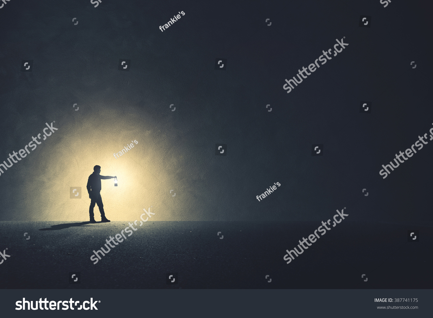 Man with lamp walking illuminating his path