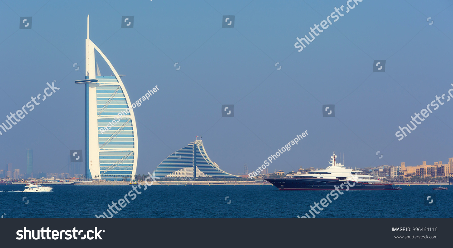 Luxury yacht near Jumeirah beach hotels and boats in luxury Dubai city United Arab Emirates