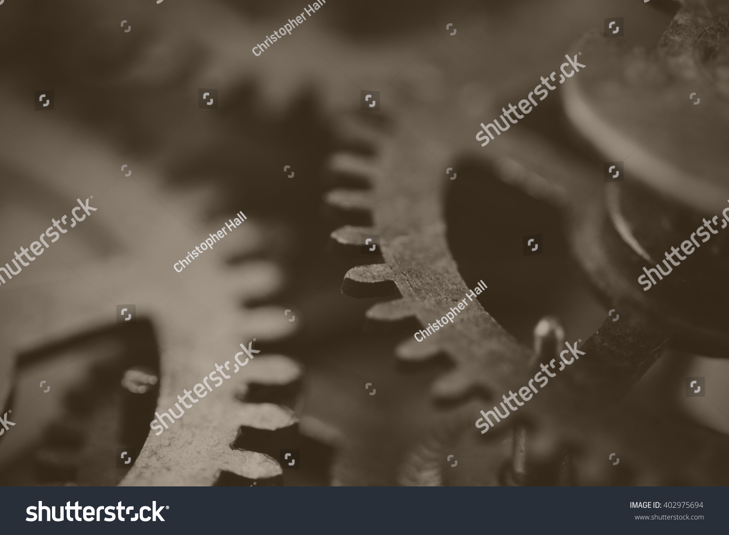 Close up of cogs from the inside of a clock. Black and white filter applied.