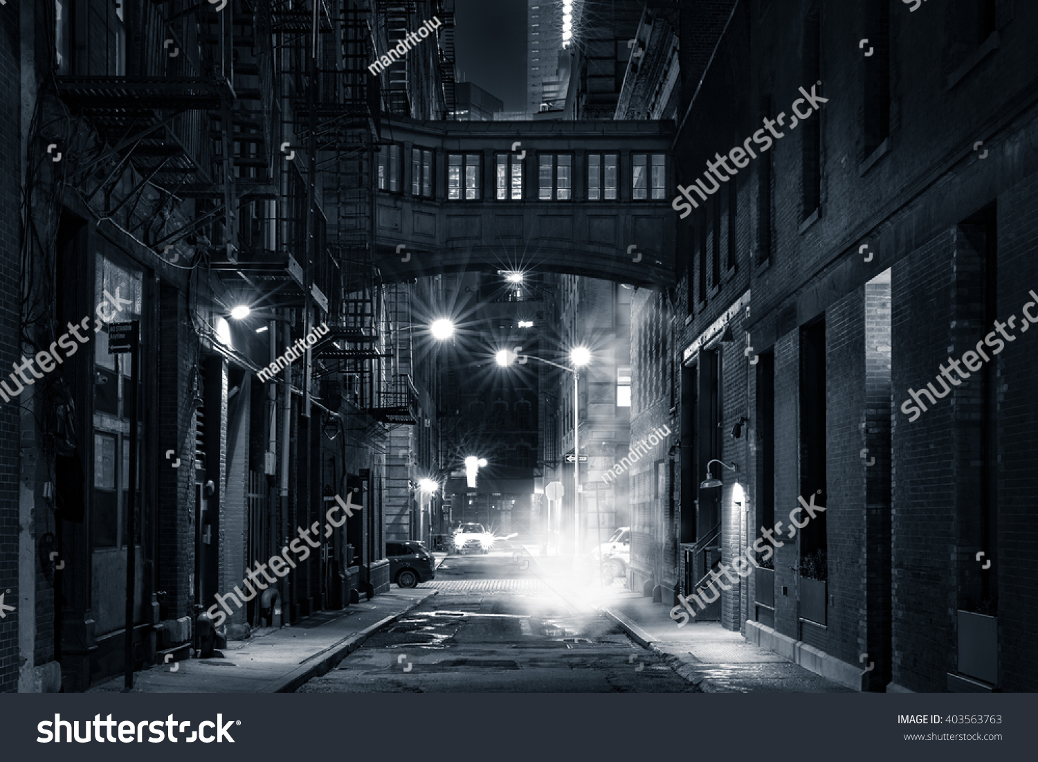 Moody monochrome view of Staple street skybridge by night  in Tribeca  New York City