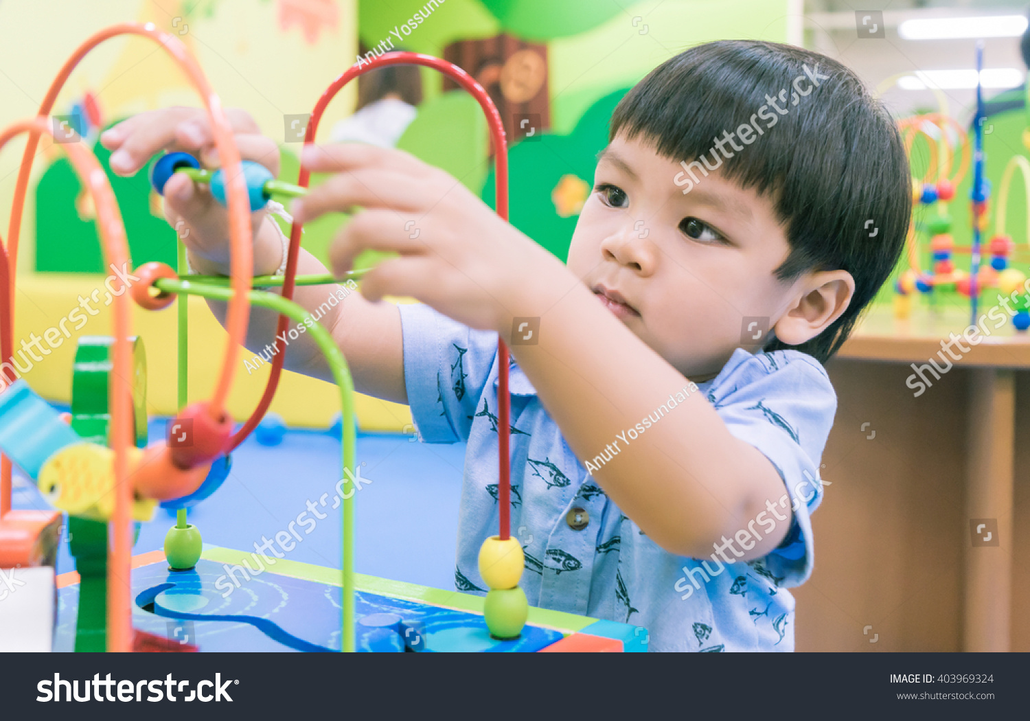 Asian Baby playing with Educational toy