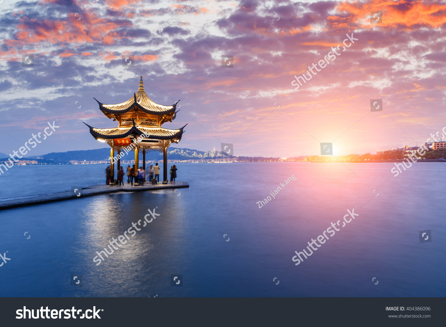 ancient pavilion of Hangzhou west lake at dusk  in China
