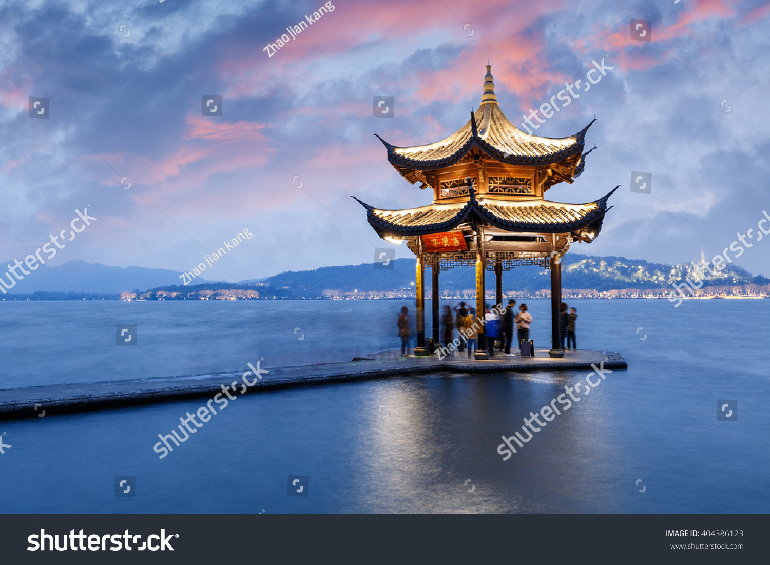 ancient pavilion of Hangzhou west lake at dusk  in China