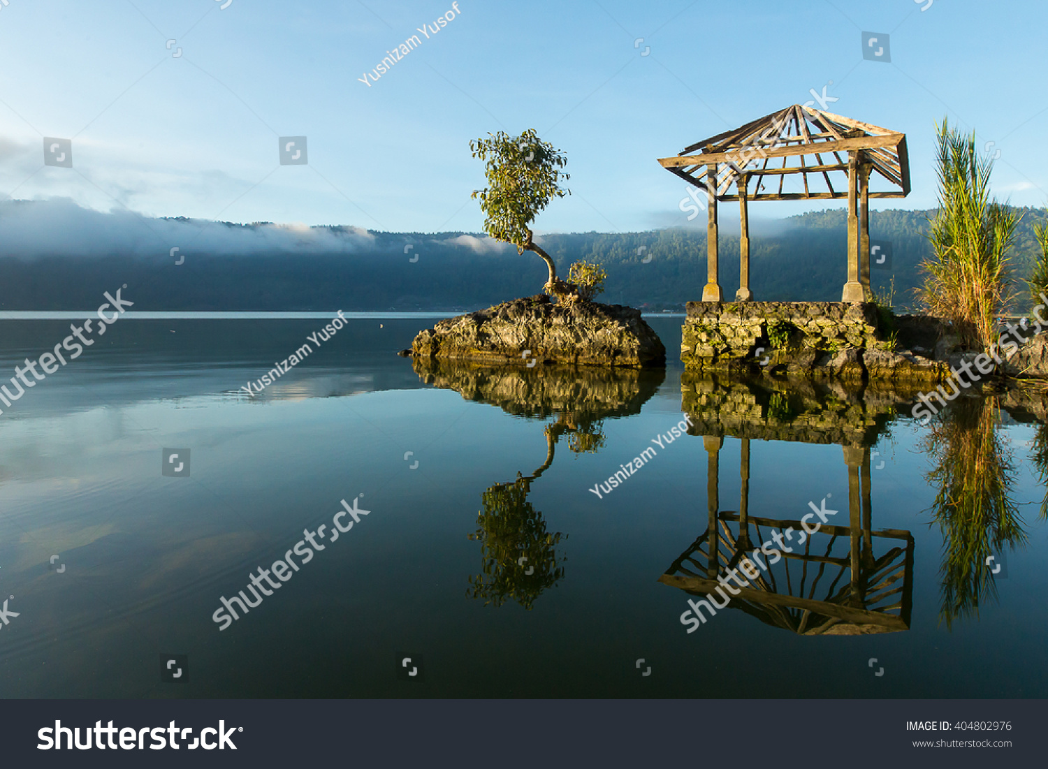 Beautiful Lake Batur landscape overlooking serene and beautiful Mount Batur during blue sky cloudy day  Bali Indonesia.