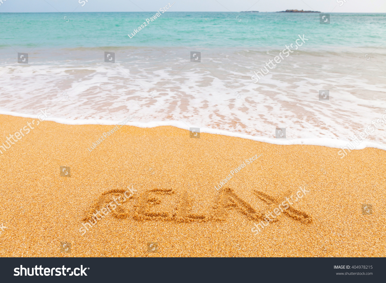 Inscription "LEISURE" made on beautiful beach by the blue sea