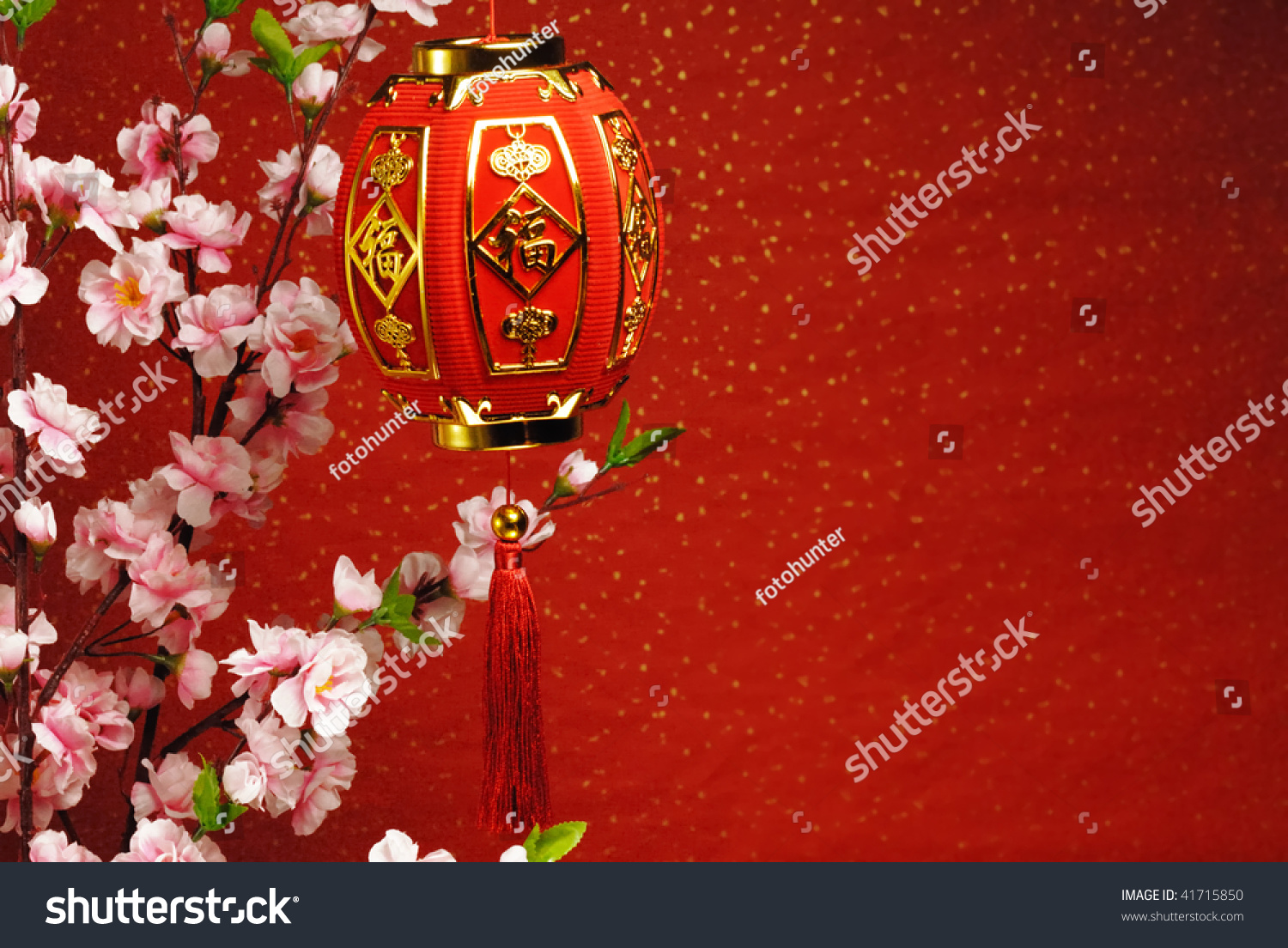 Chinese new year decoration--Traditional lantern and plum blossom on a festive background.