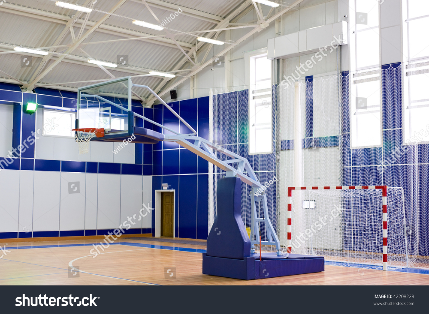 part of sports gym with modern basketball upright and soccer goal