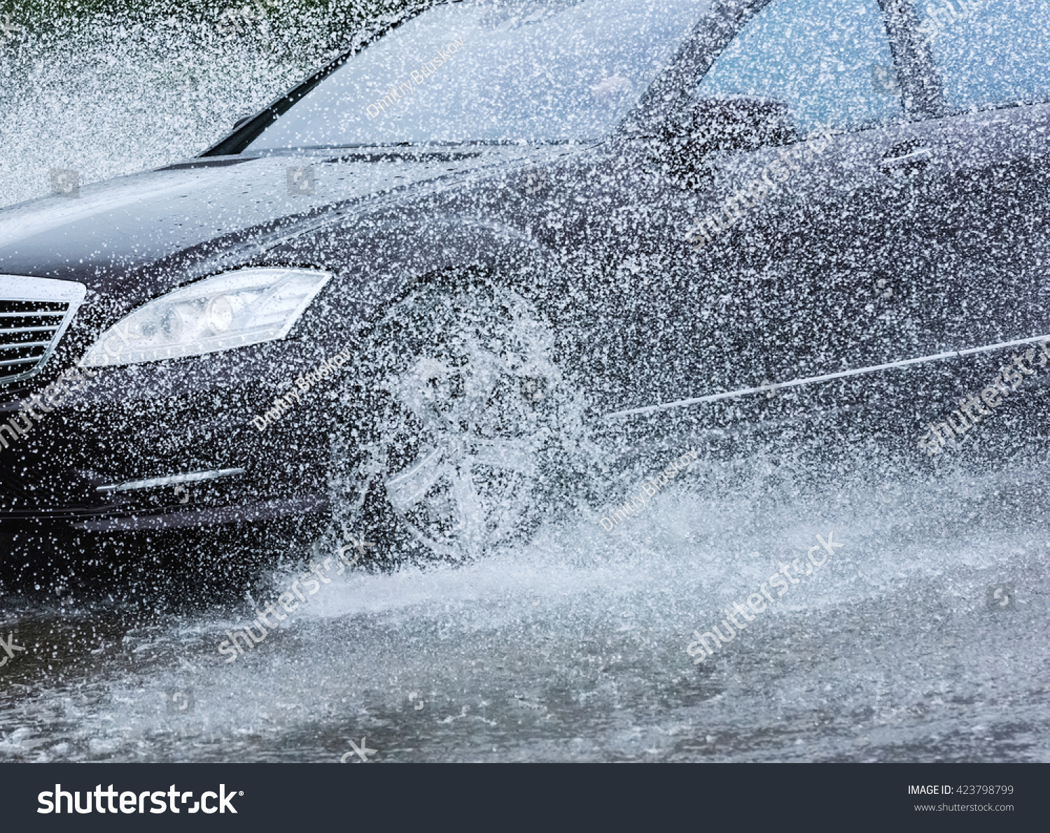 motion car rain big puddle of water spray from the wheels