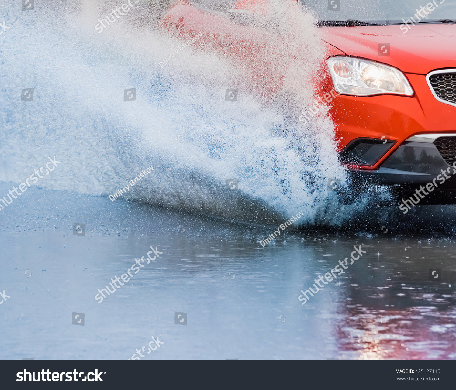 motion car rain big puddle of water spray from the wheels