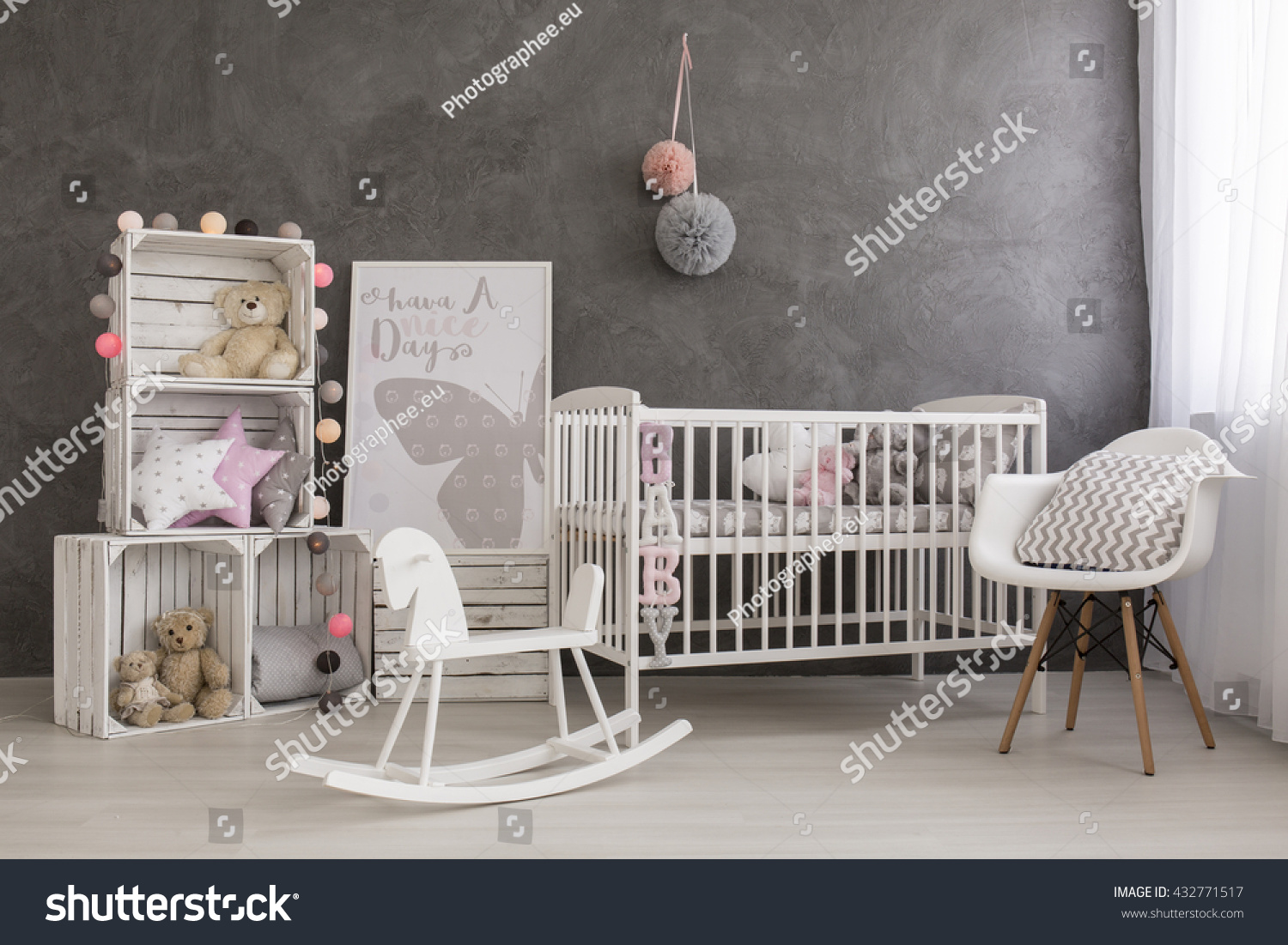Shot of a cozy baby girl nursery room