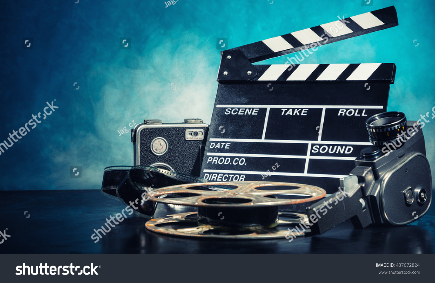Retro film production accessories still life. Concept of filmmaking. Smoke effect on background