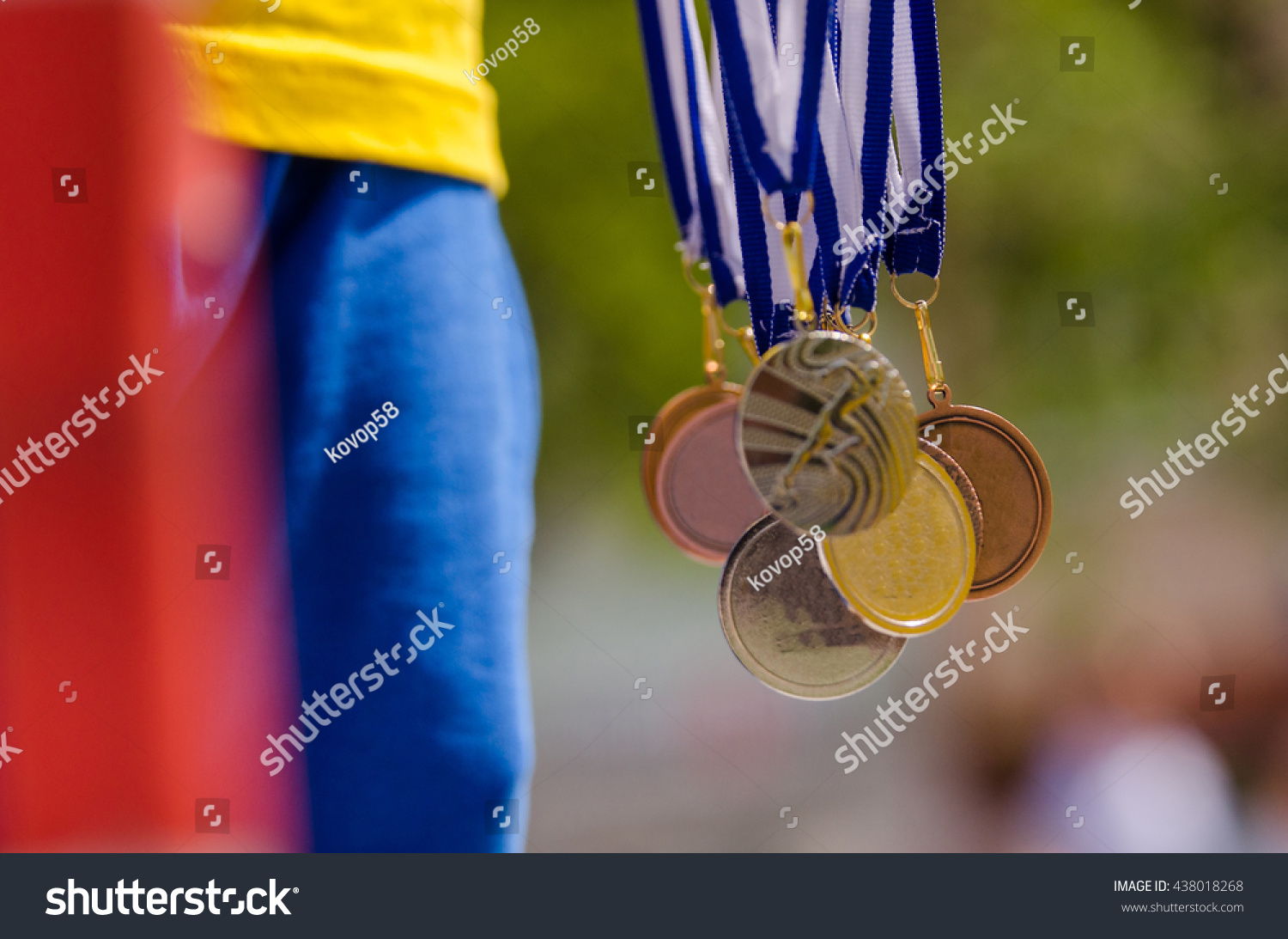 Gold  silver and bronze with symbol of running athlete. Nice wallpaper for summer olympic game in Rio
