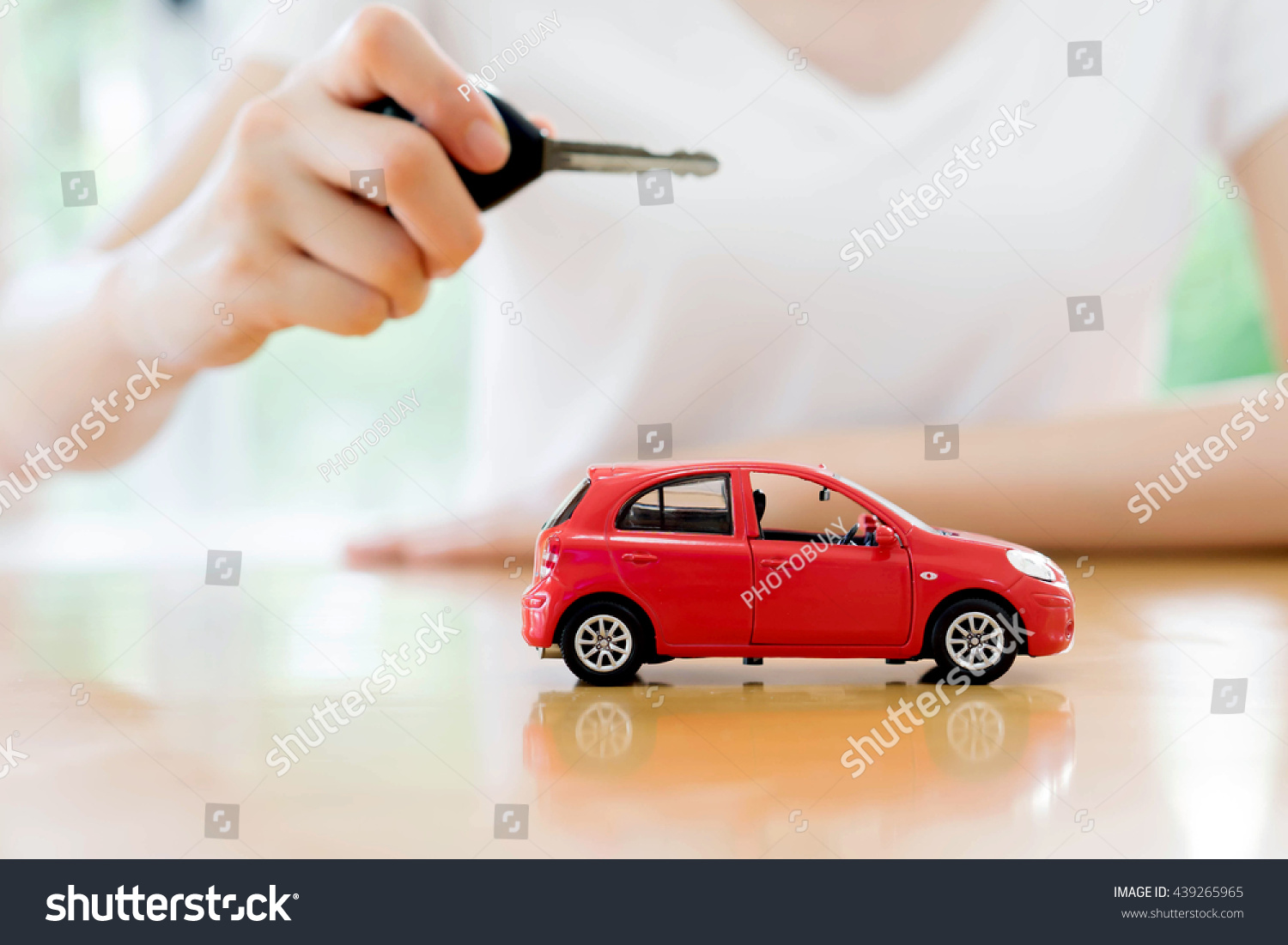 small car and key for car  car leasing and car loan concept