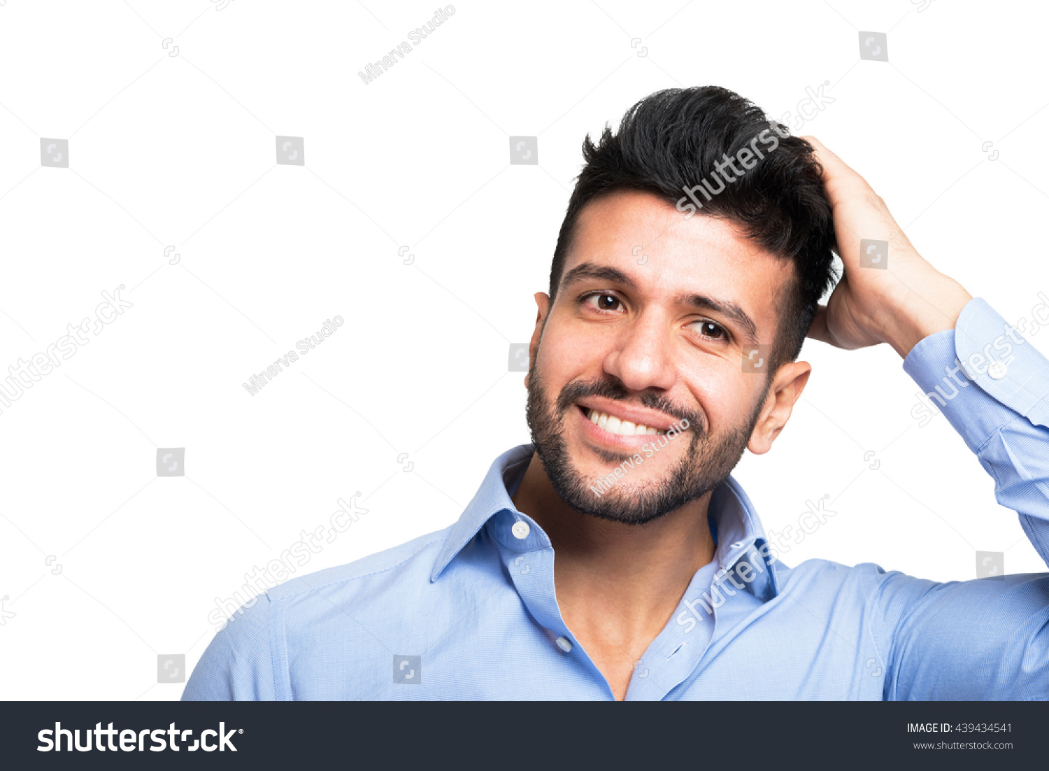 Man touching his hair. Isolated on white
