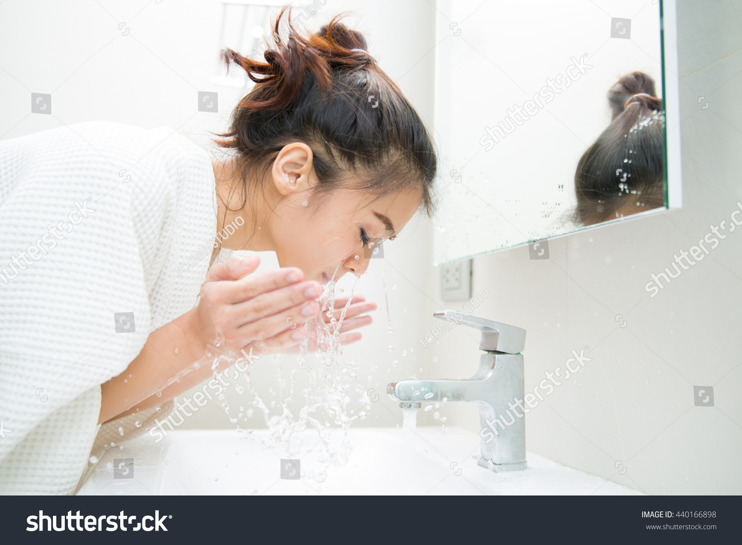 Woman wakes from sleep and she was cleansing the morning before shower