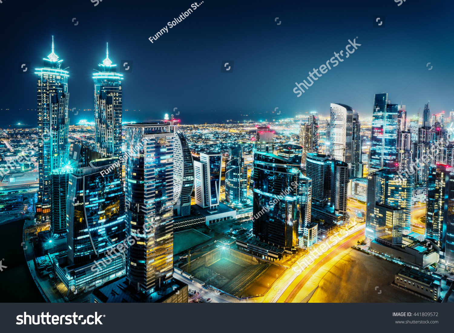 Fantastic view of a big city at night with illuminated modern architecture. Dubai downtown United Arab Emirates.