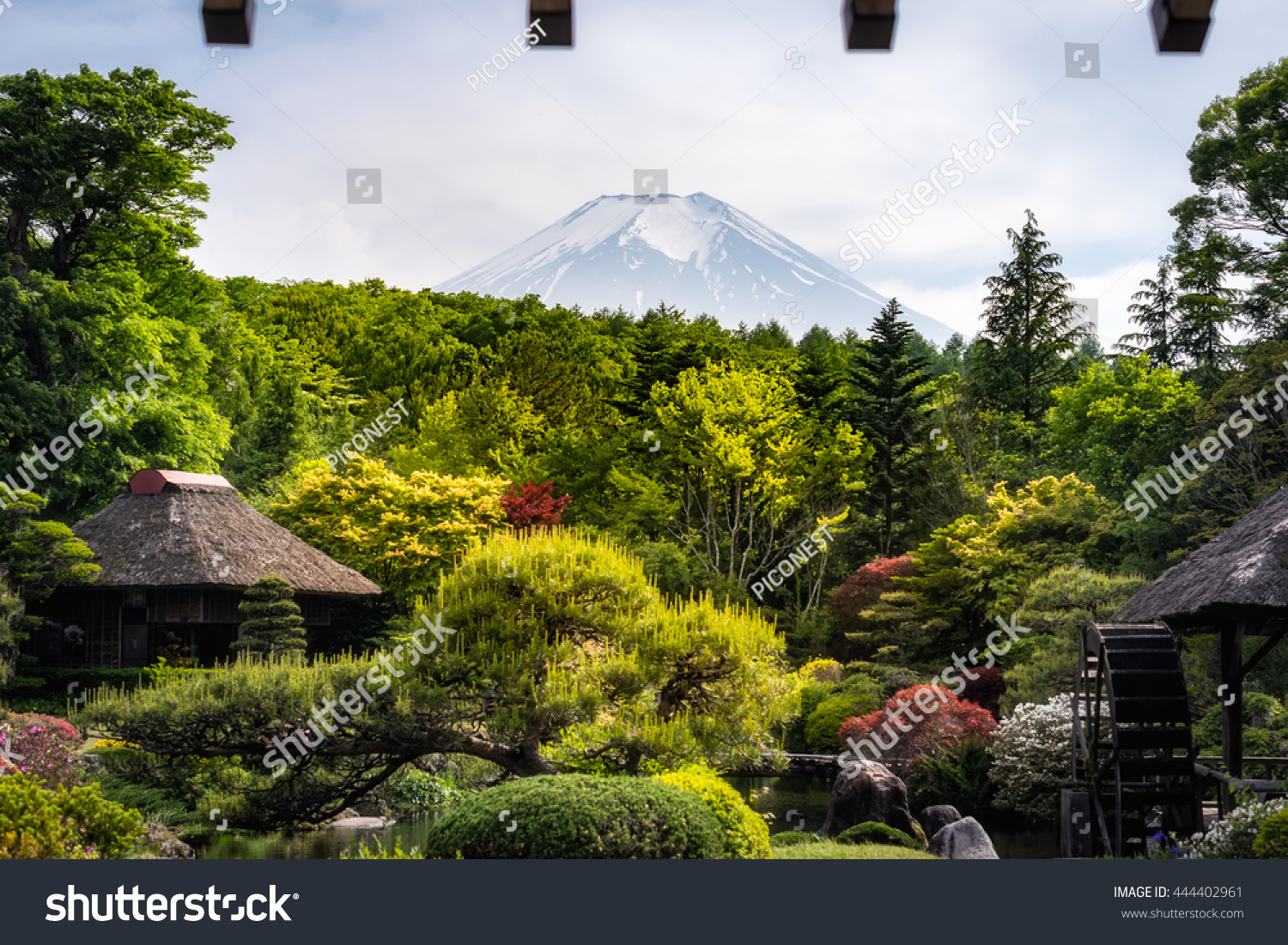 View from somewhere near Oshino Hakkai  Japan with Mt. Fuji in the background and roof on the foreground

