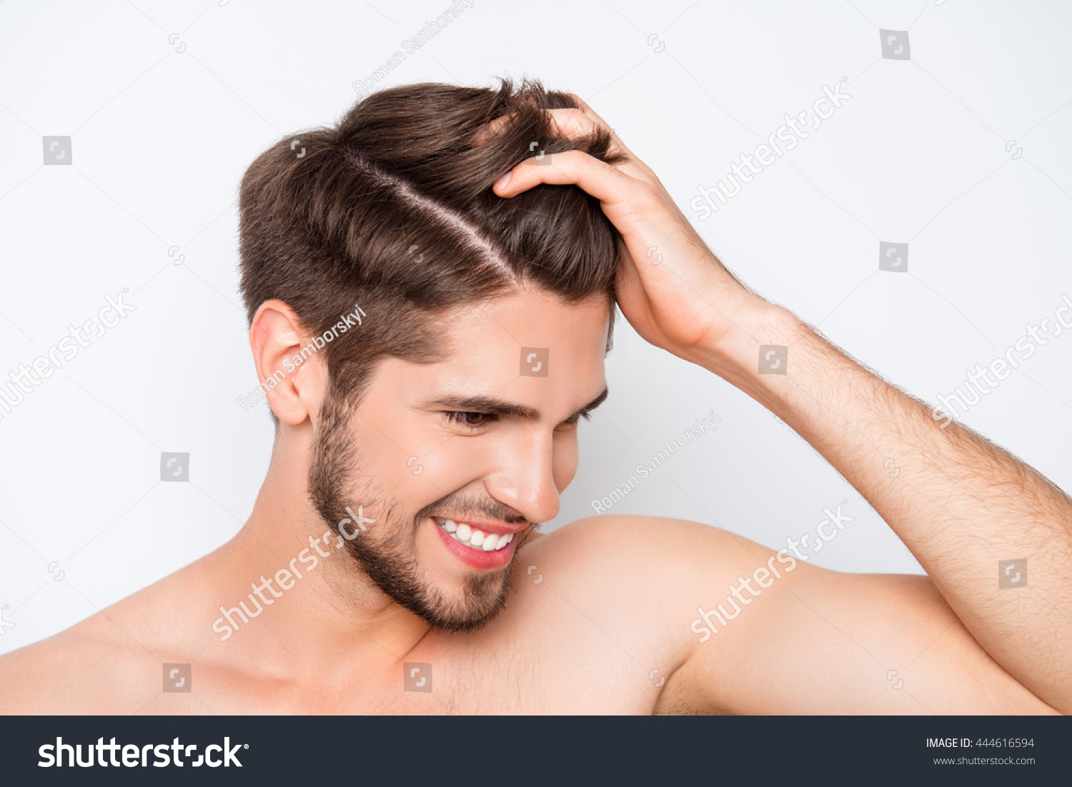 Portrait of smiling man showing his healthy hair without furfur