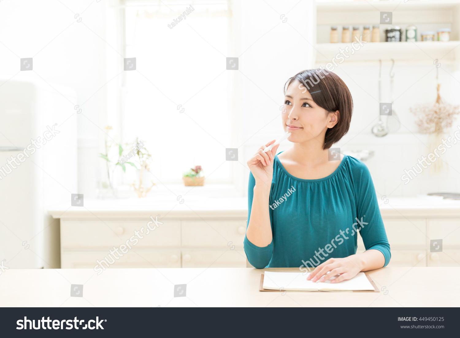 attractive asian woman in the kitchen