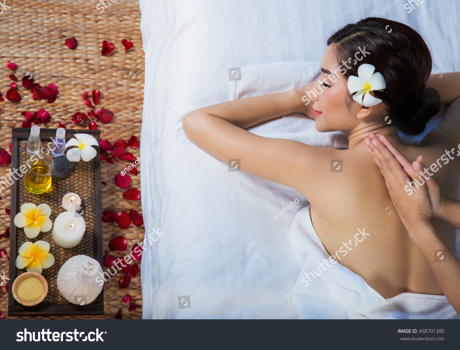 The girl relaxes in the spa salon with hand massage