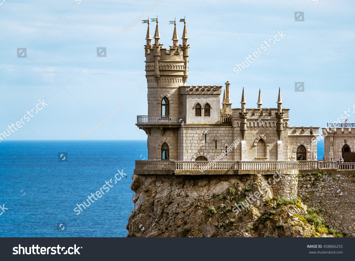 Castle Swallow's Nest on the rock in Black Sea close-up Crimea Russia. It is one of the main landmarks and tourist places of Crimea. Beautiful view of Swallow's Nest at the precipice in summer.