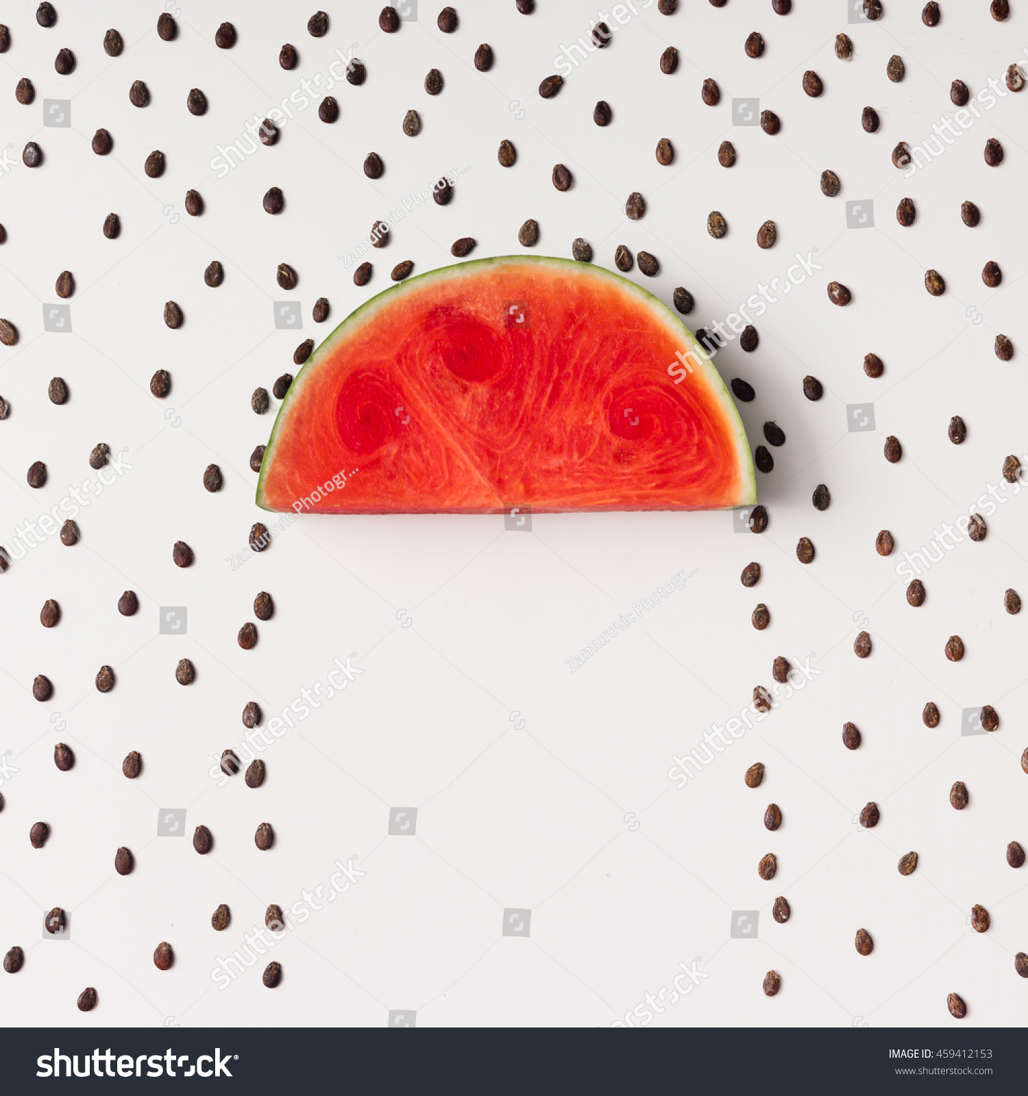 Watermelon slice with seeds raining. Flat lay. Weather concept.