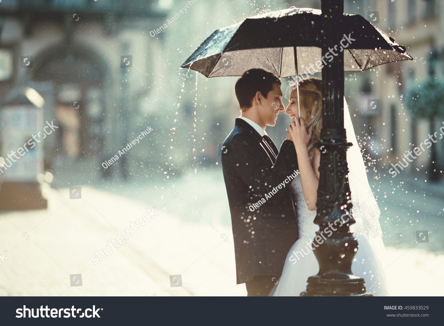 young couple hiding from the rain