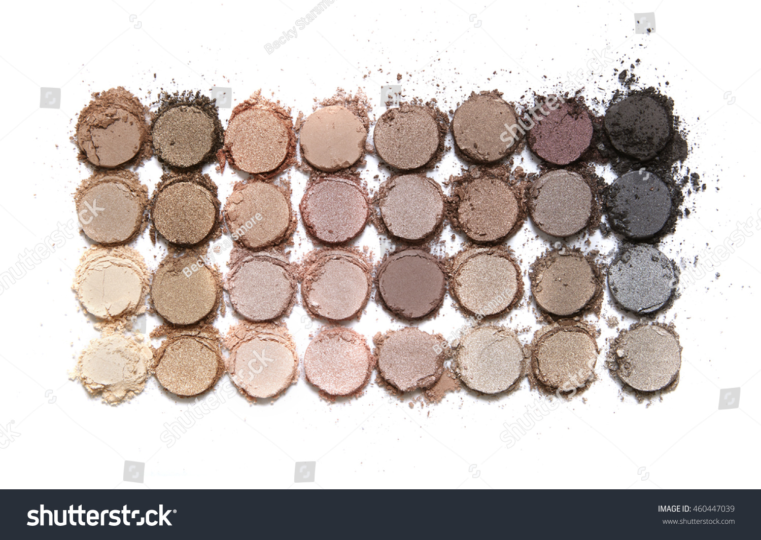 A broken neutral colored eye shadow make up palette isolated on a white background