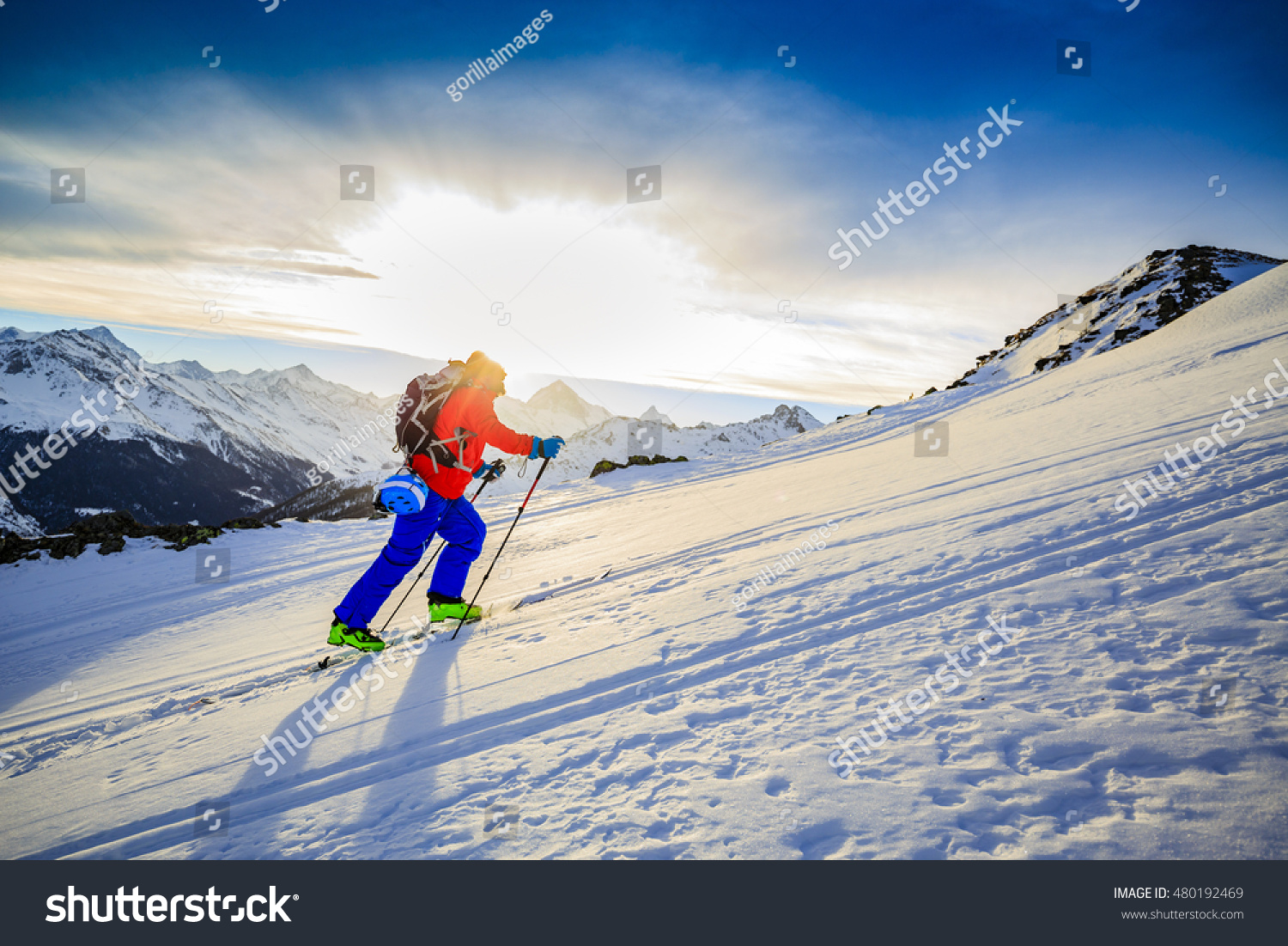 Ski touring in high mountains in fresh powder snow. Snow mountain range. Mt Fort Peak Alps region Switzerland.Wallis