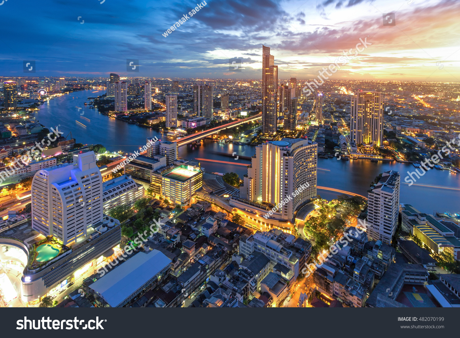 Bangkok river view at Dusk with modern business building along the Chao Phraya river (Thailand)