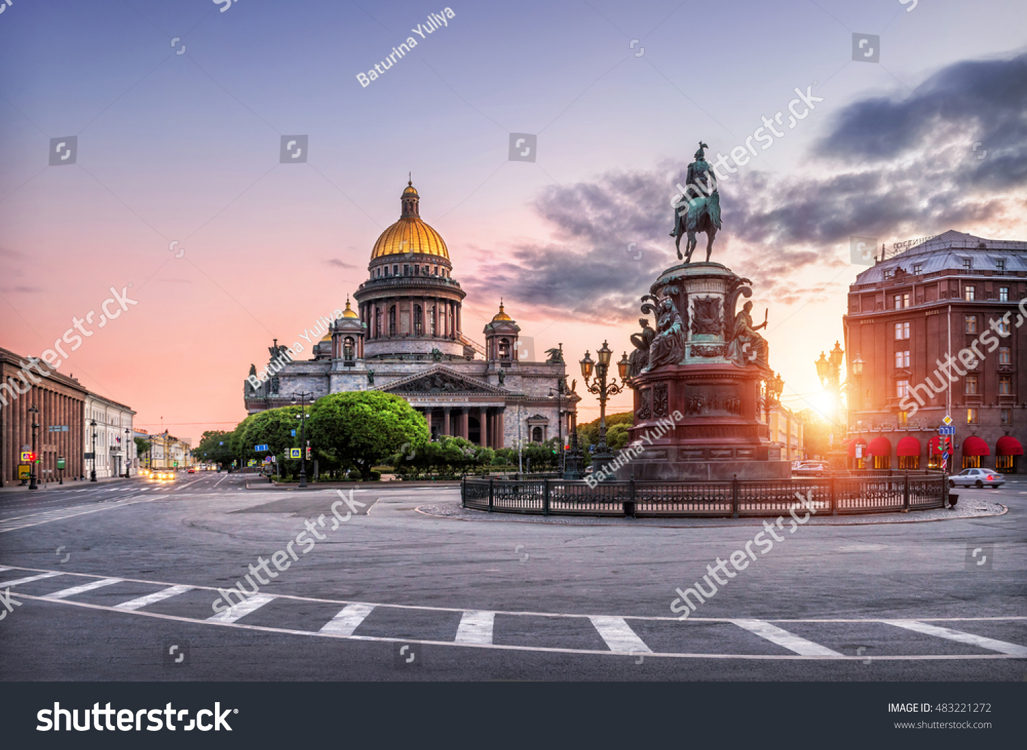 St. Isaac's Cathedral under the blue sky and pink monument to Nicholas the First on St. Isaac's Square in the early morning