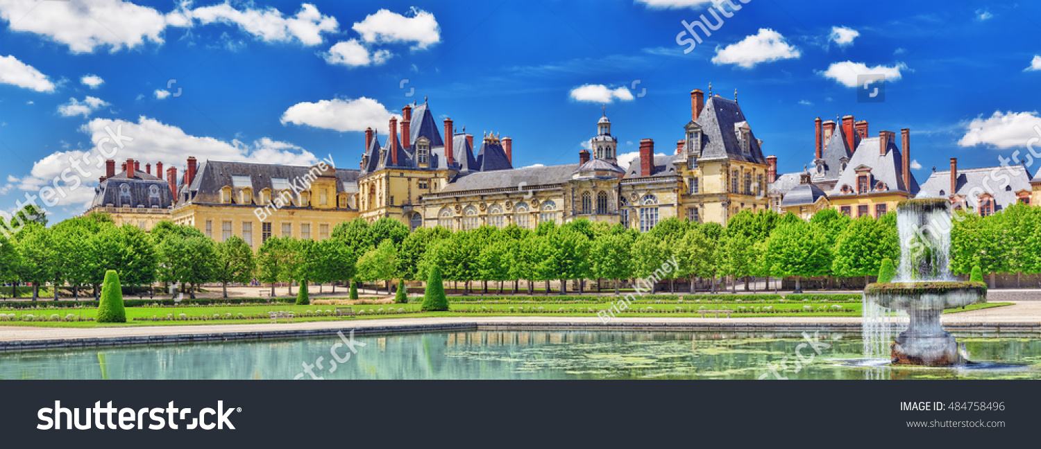 Suburban Residence of the France Kings - beautiful Chateau Fontainebleau with the fountain on foreground.