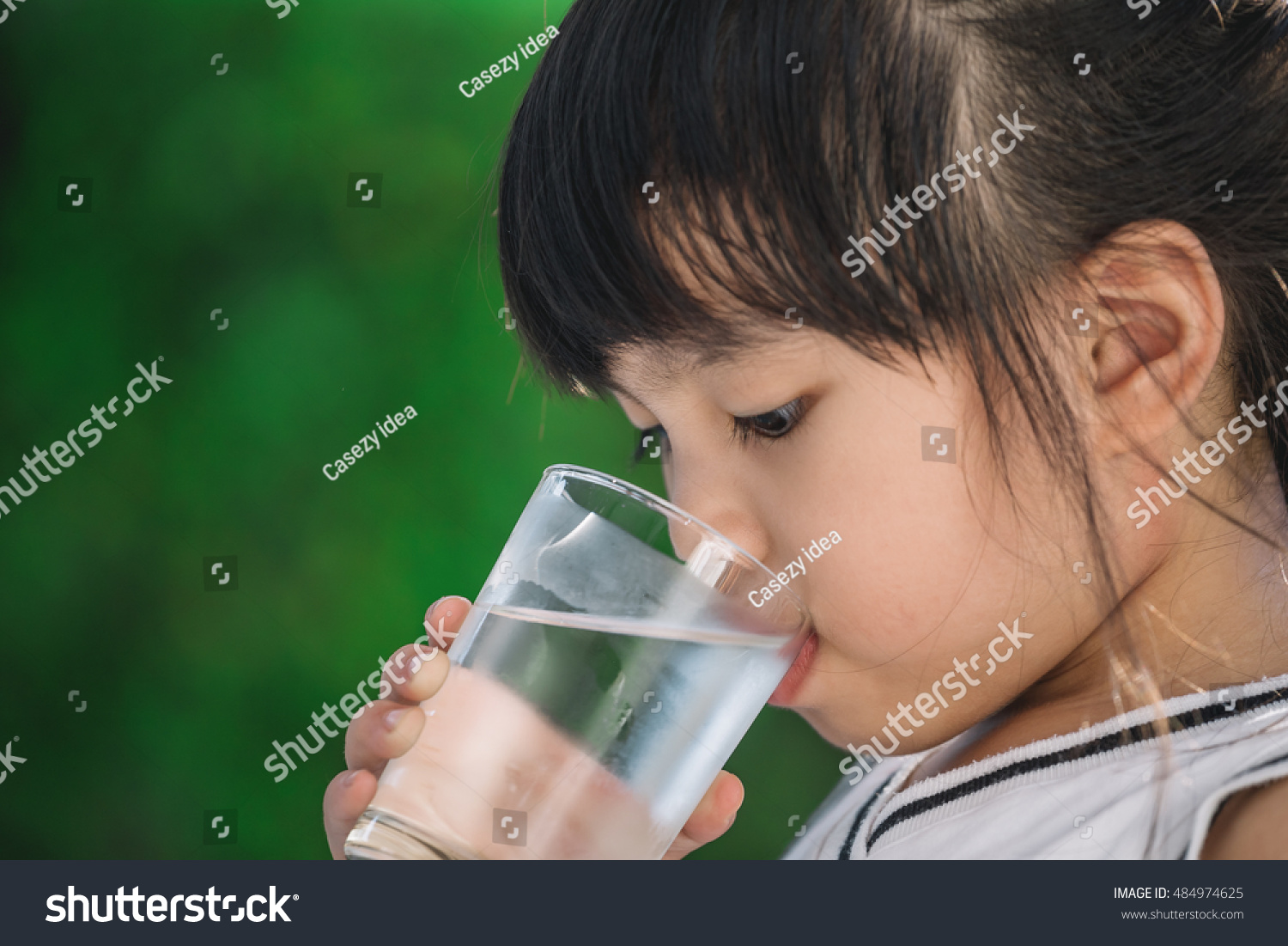 Little girl drinking water