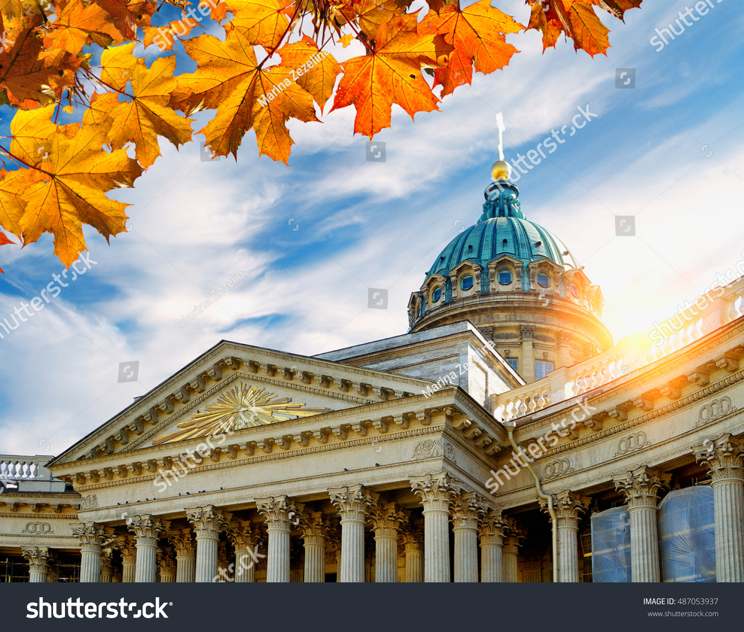 St Petersburg Russia - Kazan Cathedral framed by maple leaves in at the autumn sunset. Soft focus applied