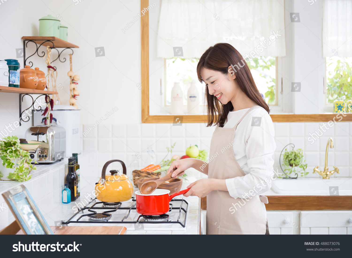 young asian woman in the kitchen?