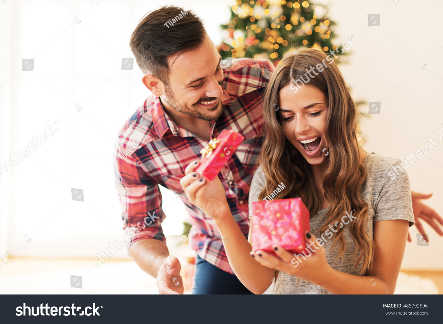 Man giving a Christmas present to his girlfriend