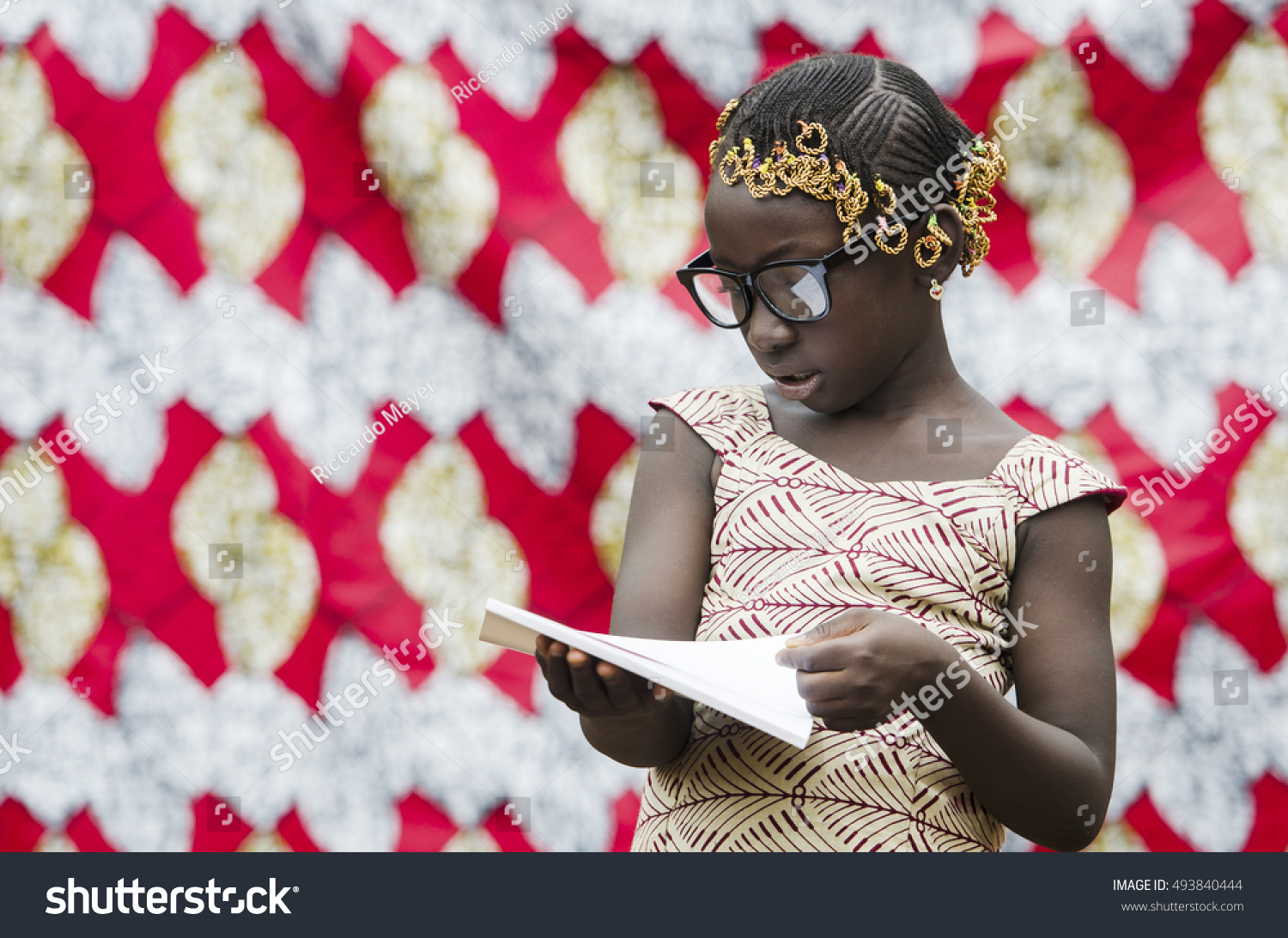 Gorgeous African School Girl Reading with Big Glasses on