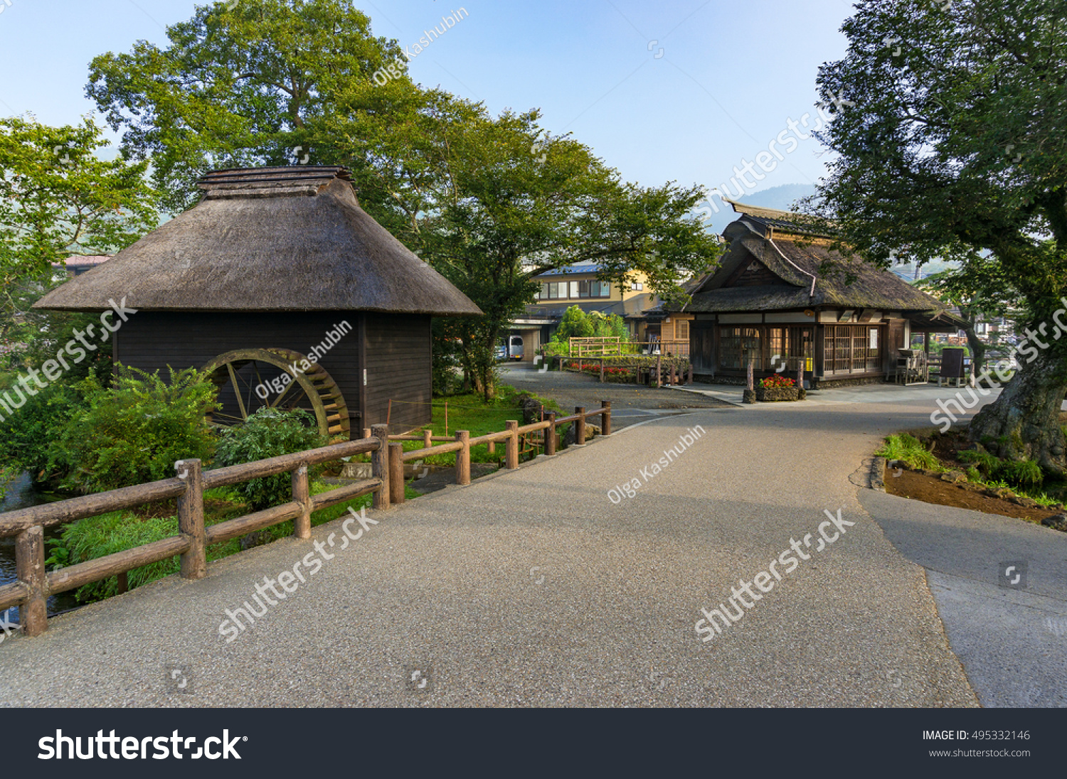 Oshino Hakkai historic village traditional thatch roof farmhouses and water wheel. Fuji Five Lakes  Japan