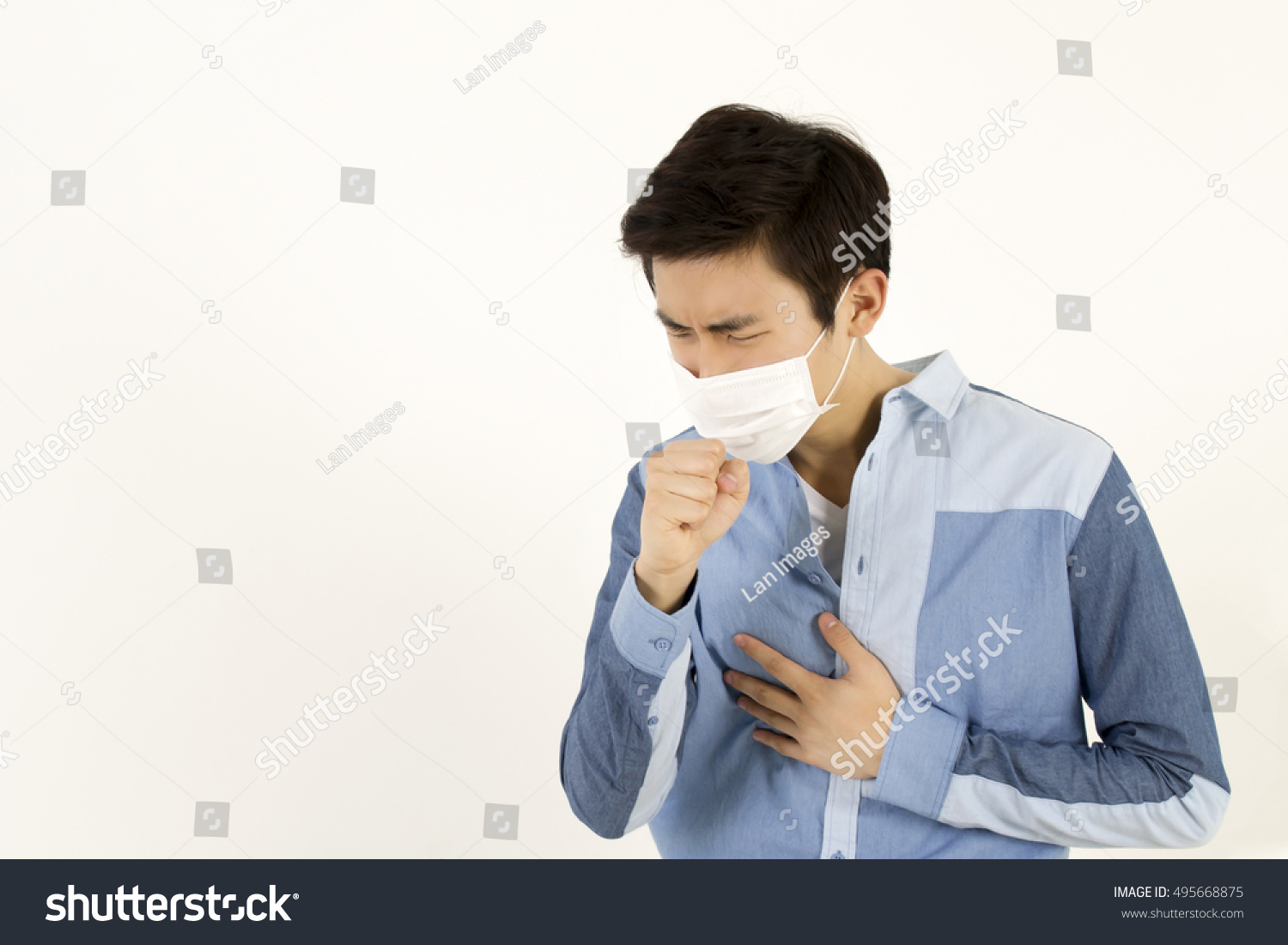 Asian man wearing a face mask with coughing