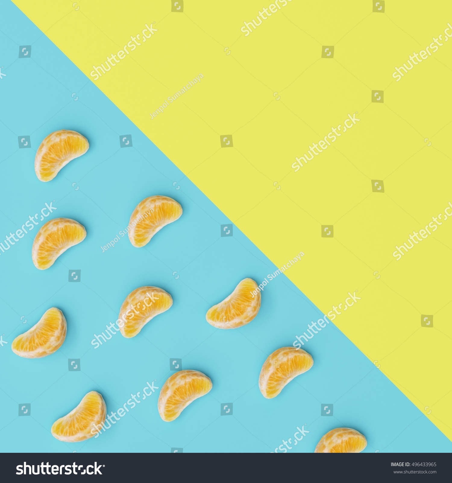 Creative Concept  Oranges petals on light blue and yellow pastel background  top view.
