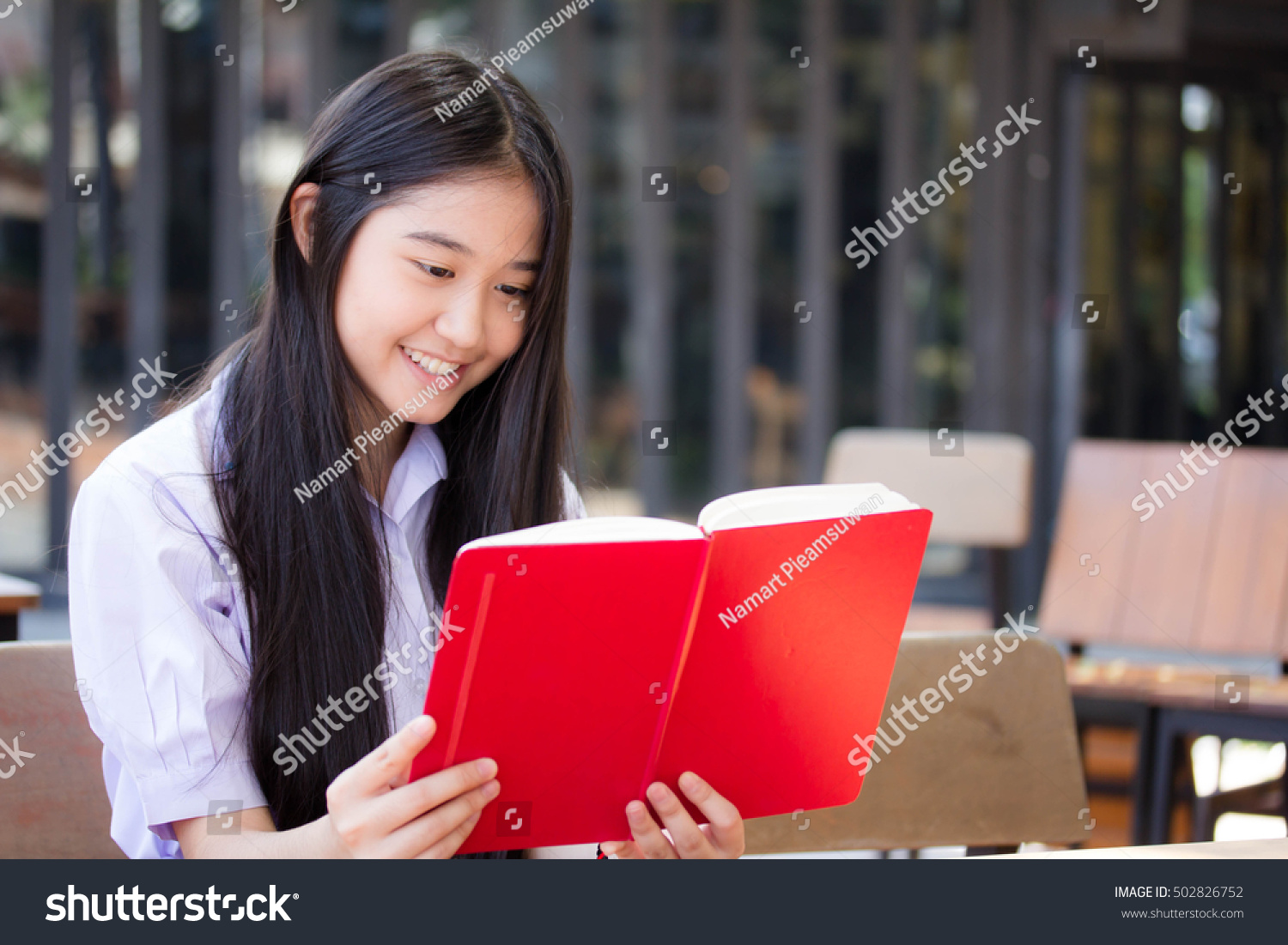 asia thai high school student uniform beautiful girl read a book