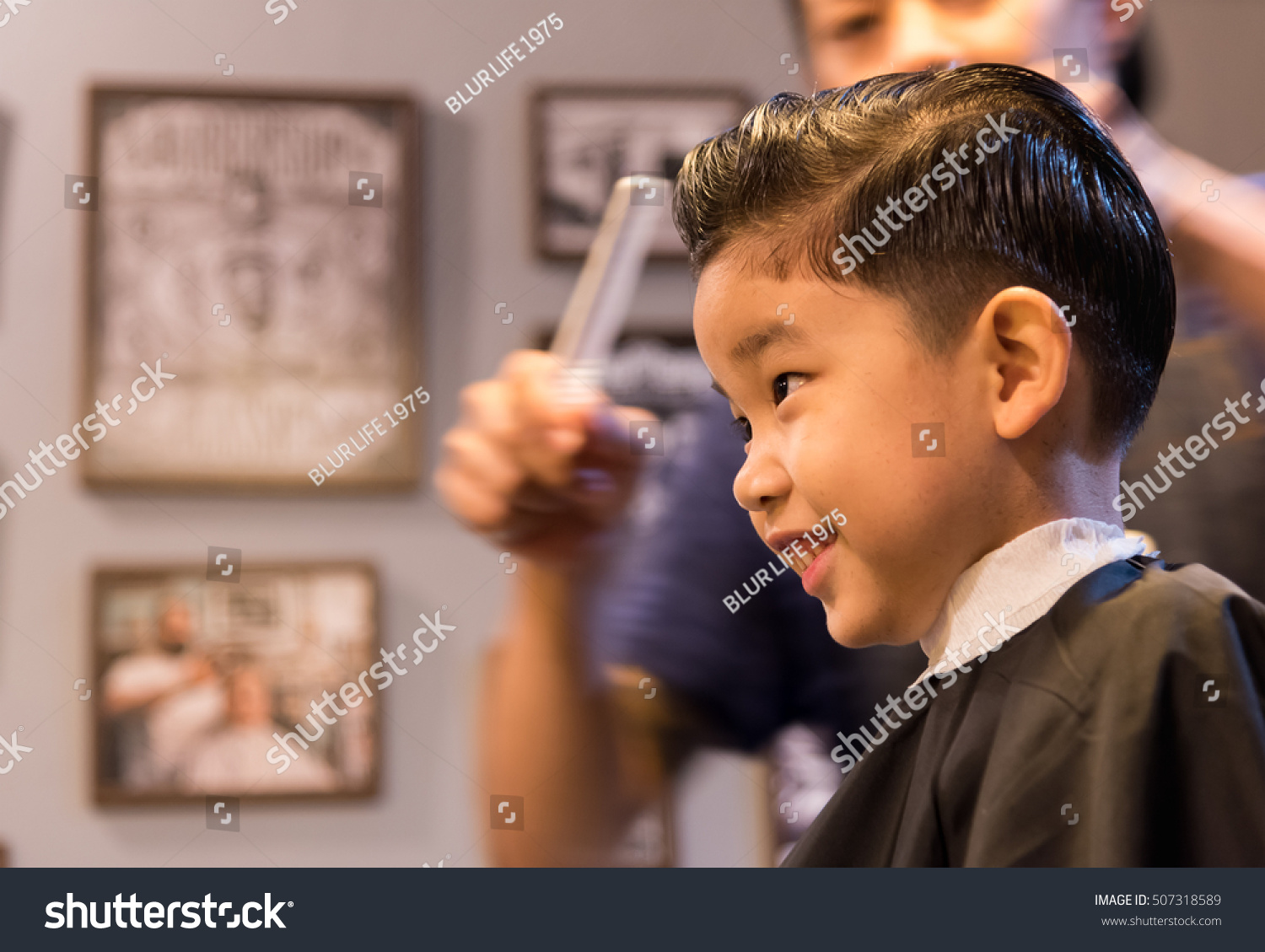 image of young asia boy at barber shop .